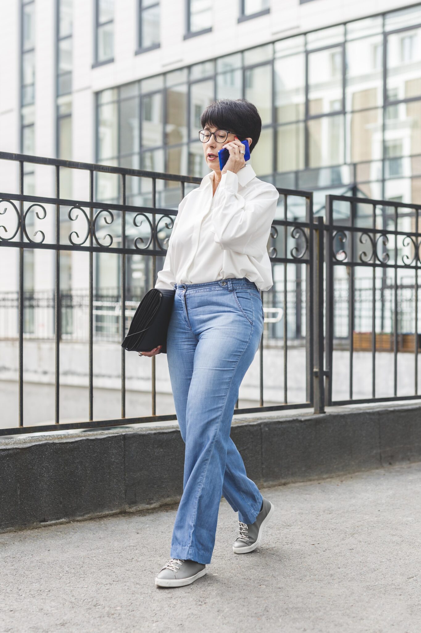 w businesswoman walking big building